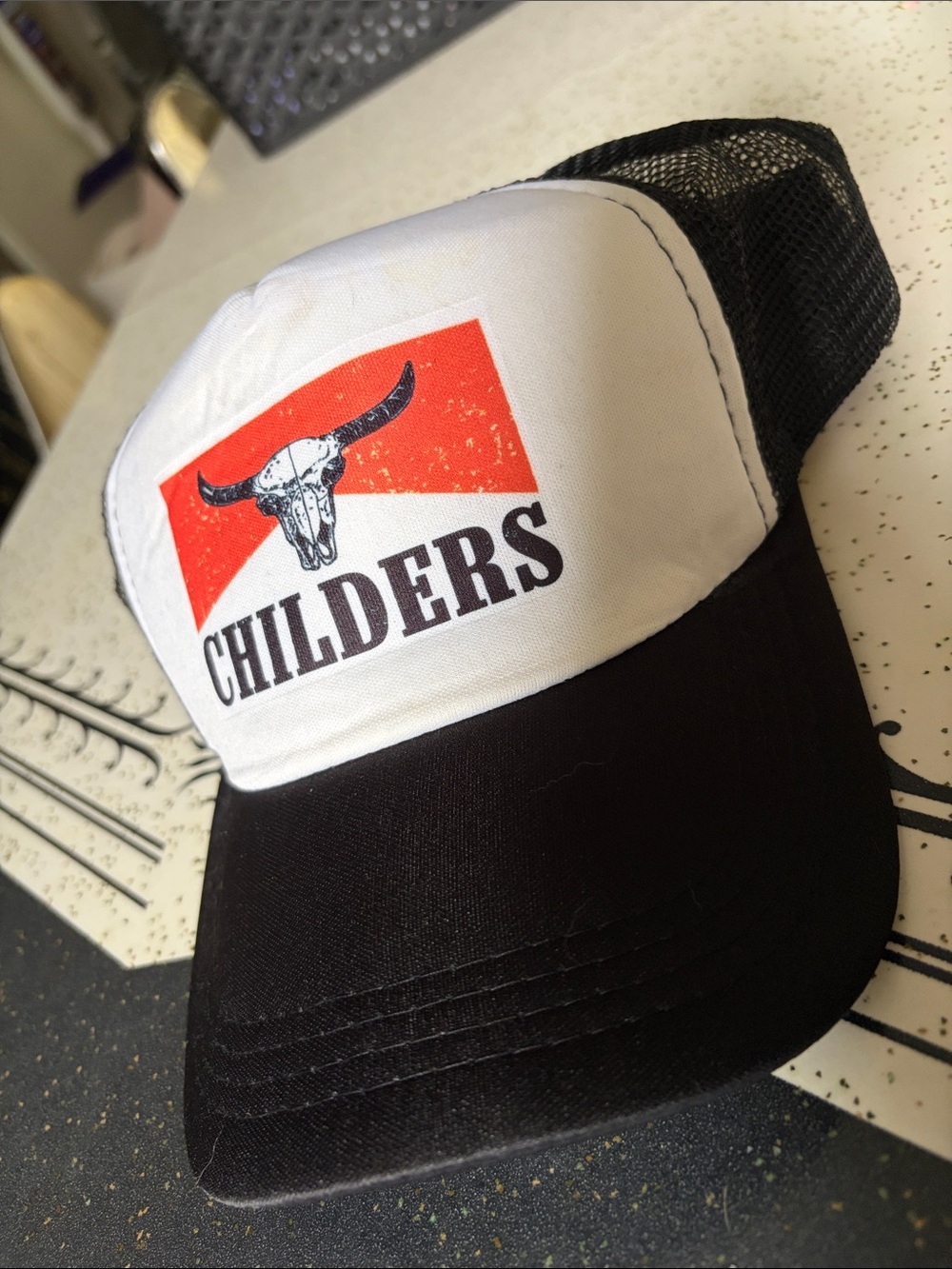 Tyler Childers Trucker Hat - Black & White with Orange Logo